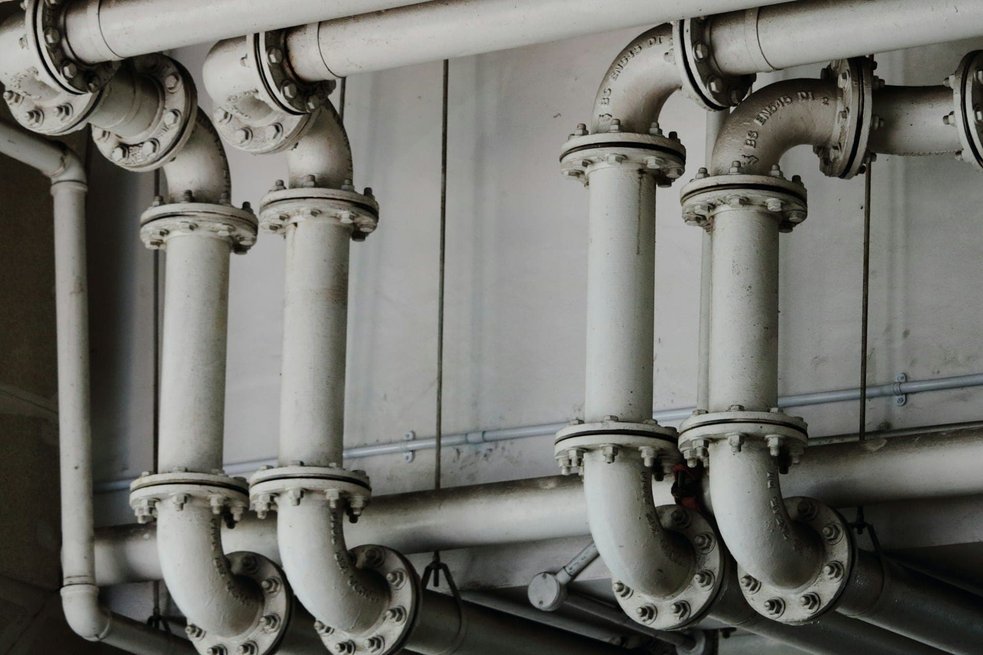 Rows of flanged steel pipework